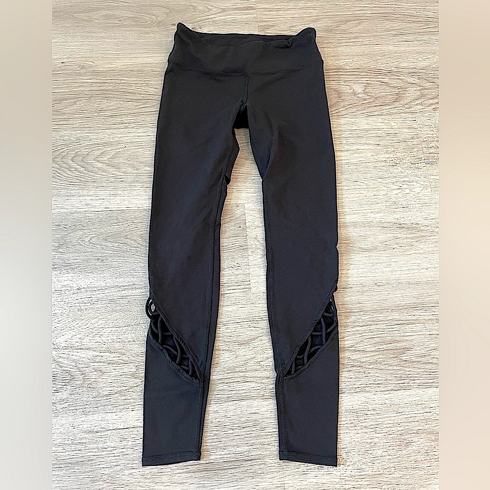 Cute ALO Yoga Black Leggings with cutouts on legs.